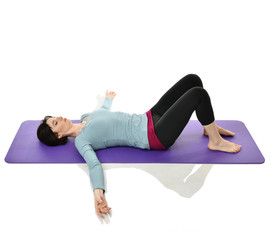 Obraz premium Mother woman exercising doing postnatal workout. Female fitness stretching hands and legs in gym work out exercises