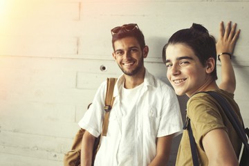 young students with books on campus or college