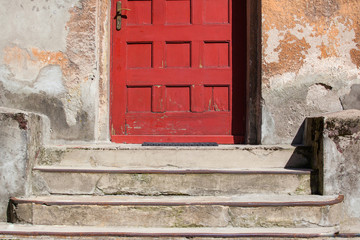 red front door in the old building