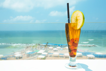  Cocktail drink on wood table on the sky background. Chill out and summer holiday concept