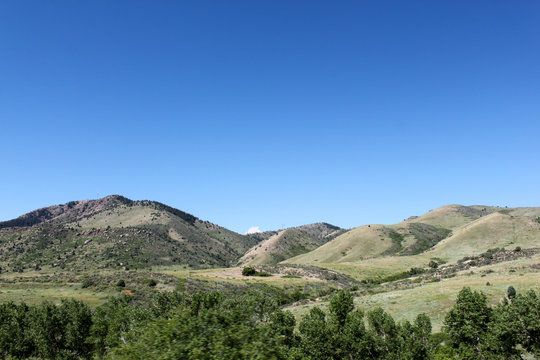 Foothills with blue sky in background