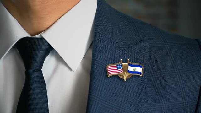Businessman Walking Towards Camera With Friend Country Flags Pin United States of America - Salvador