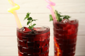 Glass with delicious refreshing cocktail, closeup