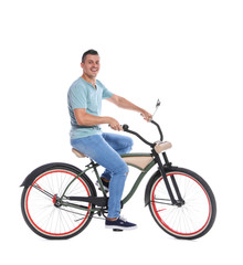Fototapeta na wymiar Portrait of handsome man with bicycle on white background