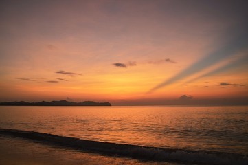 Fototapeta premium the ray of sunrise moment at Cherating beach, Malaysia