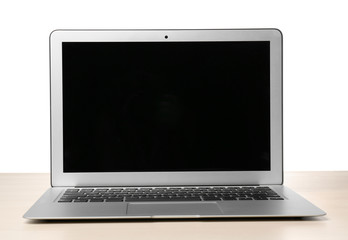 Fototapeta premium Modern laptop with blank screen on table against white background