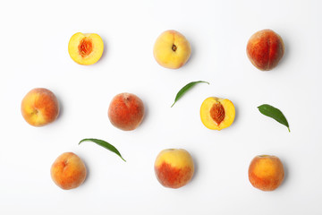 Naklejka na ściany i meble Composition with fresh sweet peaches on white background