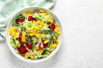 Tasty beets salad on table, top view