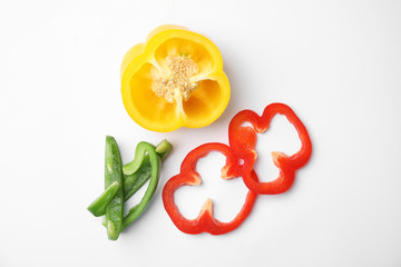 Cut ripe paprika pepper on white background, top view