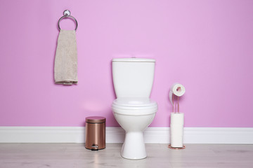 New ceramic toilet bowl in modern bathroom