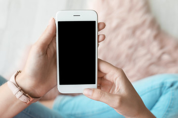 Woman using smartphone with blank screen, closeup. Mock up for design