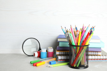 Obraz premium Different school stationery on table against light background