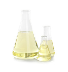 Laboratory glassware with liquid on white background. Chemical analysis