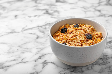 Bowl with whole grain cereal on marble table