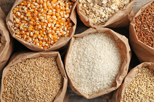 Bags of different cereal grains, top view