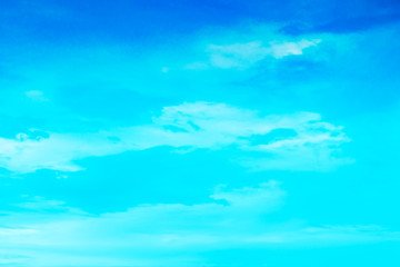 Fototapeta na wymiar clear blue sky with plain white cloud with space for text.