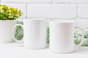Two coffee mug mockup with yellow and green flowers