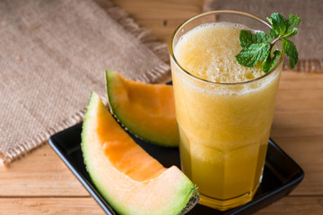 The juice of melon with mint in a glass  on the table.