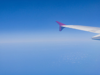 Airplane wing as seen from the passenger's seat.