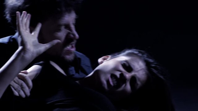 Vampire byting woman at night