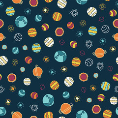 Planets and stars seamless vector background. Doodle space galaxy design. Red, orange, yellow, blue on dark blue background. Great for childrens market. Fabric, paper, back to school, cards for kids. © StockArtRoom