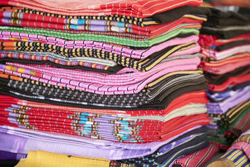 Colorful hand woven Tribal textiles in market.