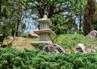 Japanese garden with waterfall, lotus, fish, water