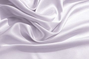 The texture of the satin fabric of lilac color for the background 