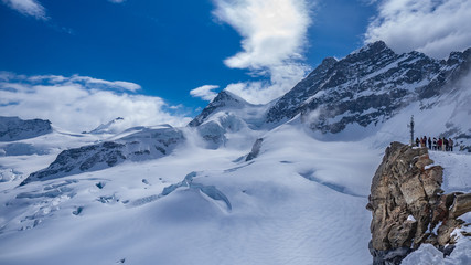 Fototapeta na wymiar Snow Landscape With Steep Mountain Background