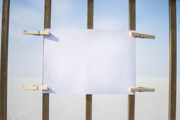 paper sign on metal fence