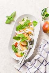 Healthy pear and shaved fennel salad with lemony dressing. Top view, space for text.
