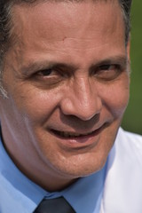 Happy Male Medical Professional Wearing Lab Coat