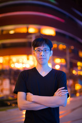 Portrait Of Asian Man Outdoors At Night