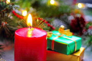 Burning candles with christmas decorations