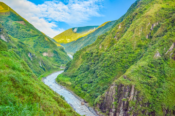 Naklejka premium Amazing landscapes in Baños Ecuador, located on the northern foothills of the Tungurahua volcano