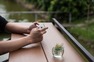 Male hand using smart phone