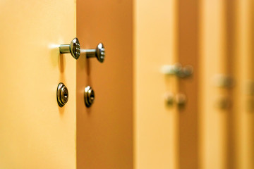 Wooden doors in sports gym locker room