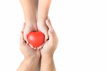 adult and child hands holding red heart isolated