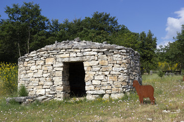 reconstruction of ancient sheepfold and fake sheep in Morcone
