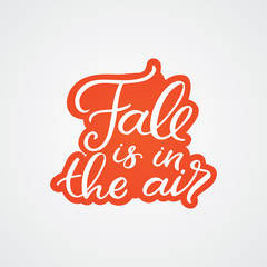 Hand drawn lettering sticker. The inscription: Fall is in the air. Perfect design for greeting cards, posters, T-shirts, banners, print invitations. © Камилла Хайруллина