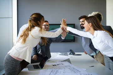 Team of architects working on construction plans