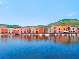 Fototapeta na wymiar River embankment in the city of Bosa with colorful, typical Italian houses. province of Oristano, Sardinia, Italy.