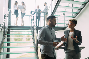 Picture of business colleagues talking in office