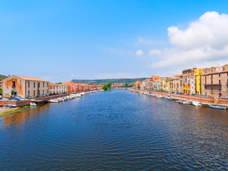 Naklejka na ściany i meble View of the river and river embankment in the city of Bosa. province of Oristano, Sardinia, Italy.