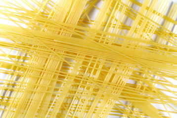 Spaghetti, yellow pasta isolated on white background, top view