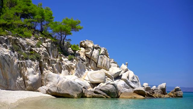 Sunny sandy beach with clear water