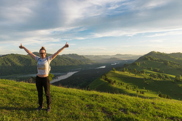 Fototapeta premium Travel, lesure and real life concept - woman in Altai mountain, beauty summer landcape