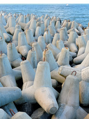 Obraz premium Concrete heavy elements protecting the port of Wladyslawowo in Poland.