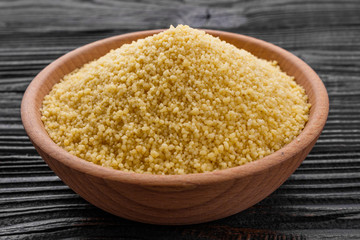 fresh couscous on a wooden rustic background