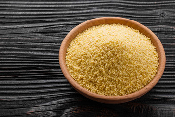 fresh couscous on a wooden rustic background